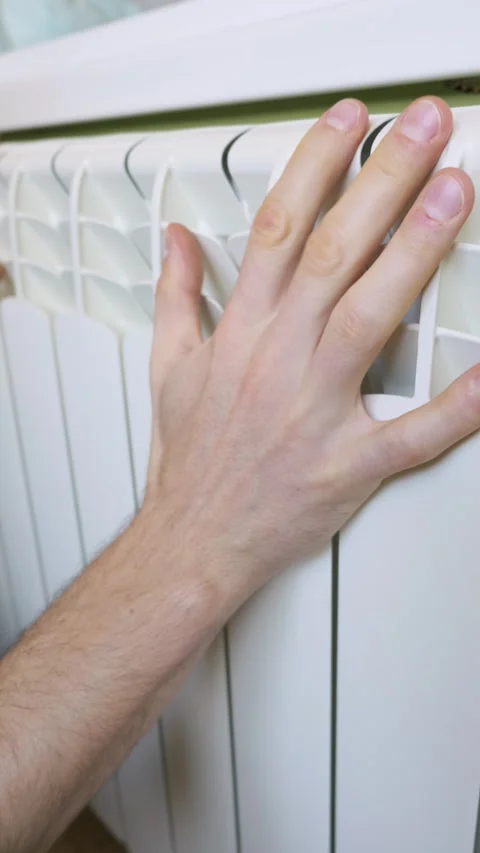 Male Hand Checking Temperature Of White Central Heating Radiator Stock Footage 329134808