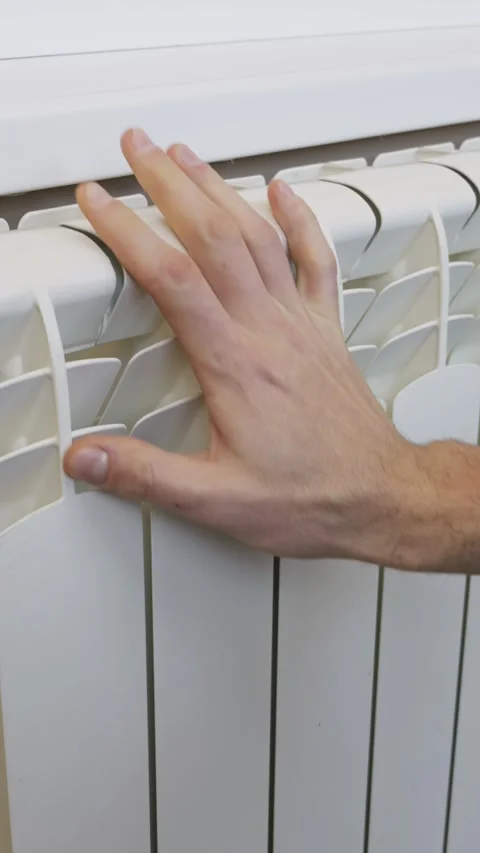 Male Hand Checking Temperature On White Heating Radiator At Home Stock Footage 329607614