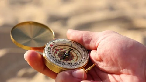 Male hand closing a compass Stock Footage 287437575