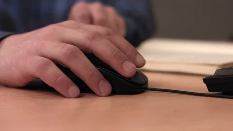 Male hand on a computer mouse Stock Footage 128168682