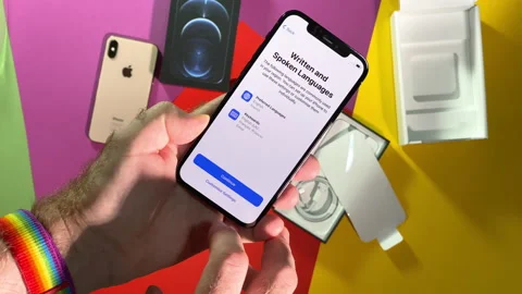 Male hand during the setup of the latest iPhone 12 Pro max Stock Footage 143124302