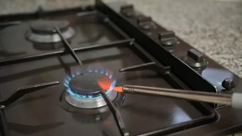 A male hand elevates the kitchen stove gas knob Stock Footage 257374487