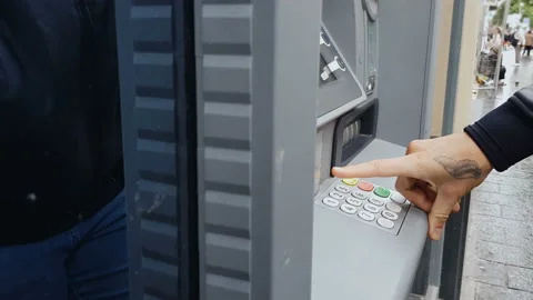 Male hand entering pin code on atm machine, cash withdrawal, payment, savings Stock Footage 98763943