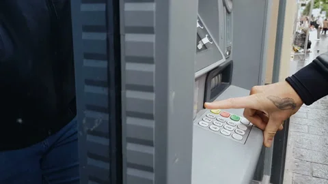Male hand entering pin code on atm machine, cash withdrawal, payment, savings Stock Footage 98797639