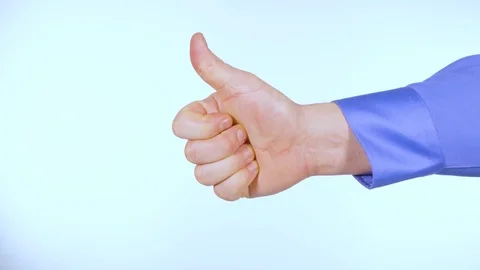 Male hand gestures pointing thumbs up and thumbs down Stock Footage 72163353