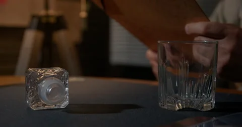 Male hand hold folder, on table empty glass of whiskey insomnia t of workaholic Video stock 247422700