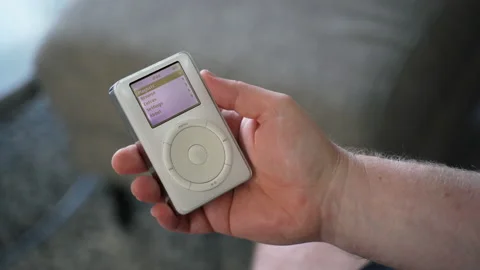 A male hand holding a 1st generation iPod Stock Footage