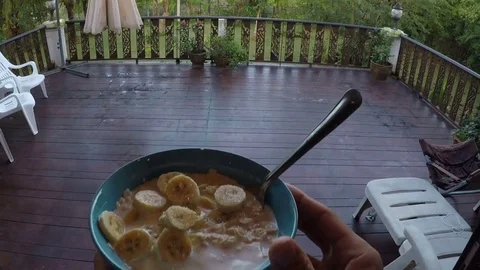 Male Hand Holding Oatmeal Porridge Plate Eating Walk To Summer Terrace Action Stock Footage