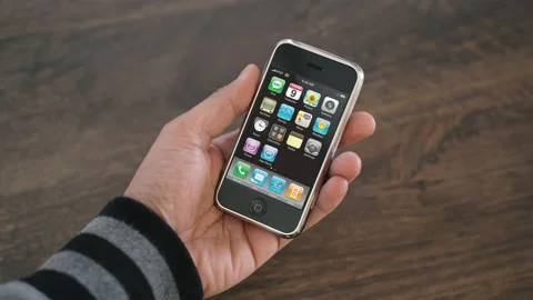 Male hand holding the original iPhone Stock Footage
