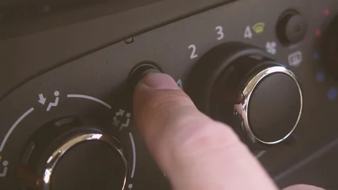 Male hand includes air conditioning in the car Stock-Footage 82931389