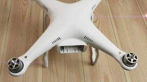 Male hand inserting a battery to a drone and turns it on Stock Footage 75355246