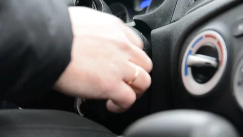 Male hand inserting car key into lock and starting engine close-up 스톡 동영상 123100591