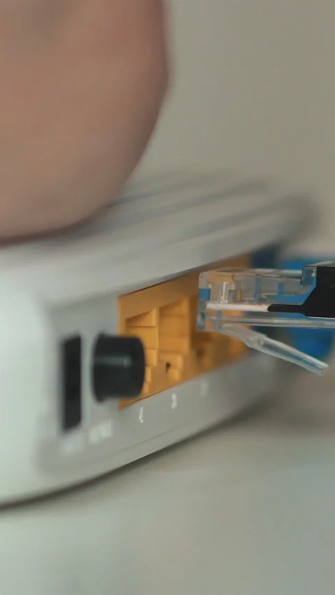 Male Hand Inserting Ethernet Cable Into Laptop. Vertical Stock Footage 270480713