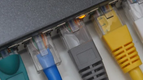 Male Hand Inserts Data Cable Into The Gigabit Network Switch. Stock Footage 104924564