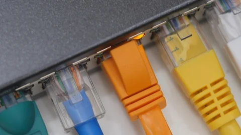 Male Hand Inserts Data Cable Into The Gigabit Network Switch. Stock Footage 104924667