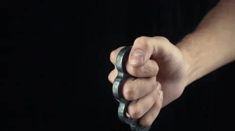 Male hand with knuckle-duster gesturing Thumbs Up Stock Footage 68932290