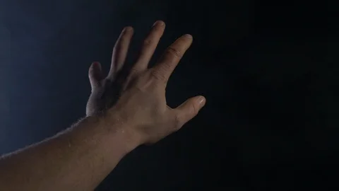 Male Hand Moving Around A Dark And Smokey Room Slow Movements Stock Footage 123710064