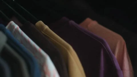 Male hand opens wardrobe taking hanger with clothes Video stock 283060998