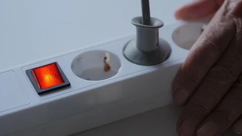 Male Hand Plugs In The Plug In Socket Electric Extension Cord And Turn On Stock Footage 95342048