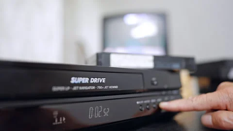 Male hand presses the button on the player. Close up. Old-style screen works at 動画素材 319890523