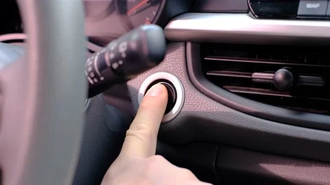 Male hand presses the start button in the car close-up. Stock Footage 232444349