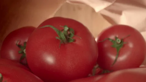 Male hand pulls tomatoes out of a grocery paper bag. Shopping Cooking Organic Stock Footage 151797152