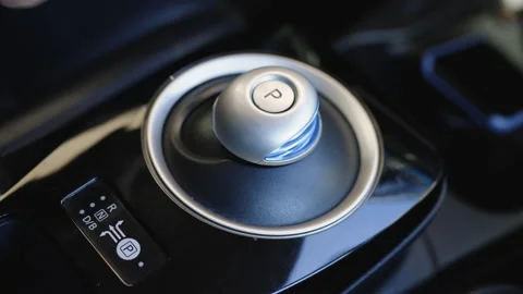Male hand pushing the button parking in electric car. Activating the emergency Stock Footage 196002009
