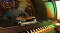 Male hand pushing buttons to play song on old musical box, selecting records 4k or 4k+ Resolution