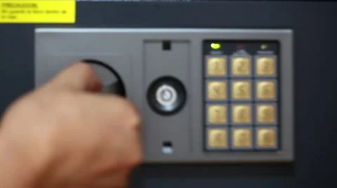 Male hand pushing security code and putting money and passports in safety box Stock Footage 62957321