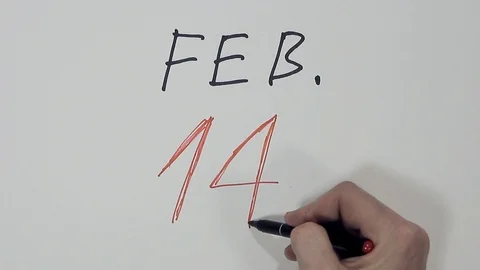 Male hand quickly writes on a white background the date of Valentine's Day Stock Footage 102274814
