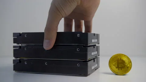 Male hand removing HDD disk drive from stack. Concept of mining on hard disks. Stock Footage 155321173