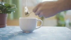 Pouring hot boiling water into cup or mu, Stock Video