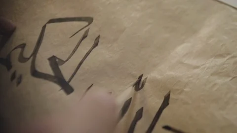 Male hand with a ring finish write calligraphic Arabic letters Stock Footage 102322188