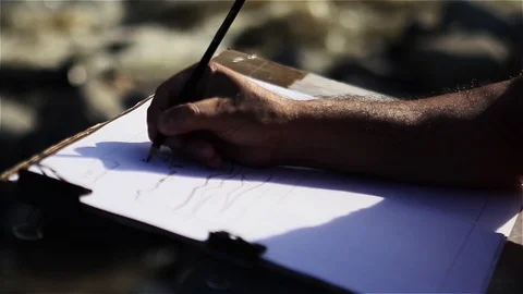 Male Hand scribbling on a Drawing Board with a Crayon and a Black Pencil. Stock Footage 88465868