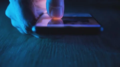 Male hand scroll mobile screen app on smartphone surf internet at night Stock Footage 236629954