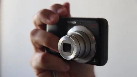Male hand is shooting with a compact camera Stock Footage 139936045