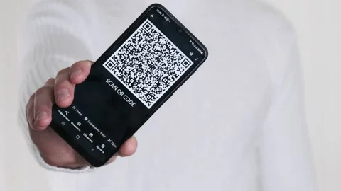 Male Hand Shows QR Code on Smartphone on... | Stock Video | Pond5