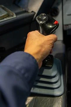 Male hand on a side stick controller of a commercial airplane. Stock Photos
