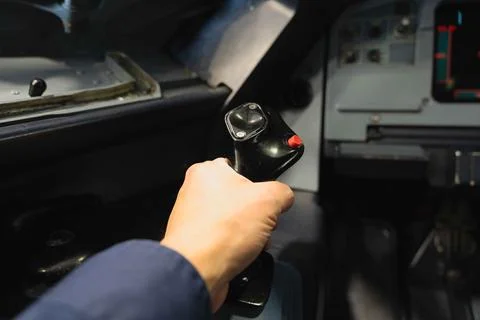 Male hand on a side stick controller of a commercial airplane. Stock Photos
