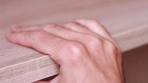 Male hand slipping down on table 動画素材 90442666
