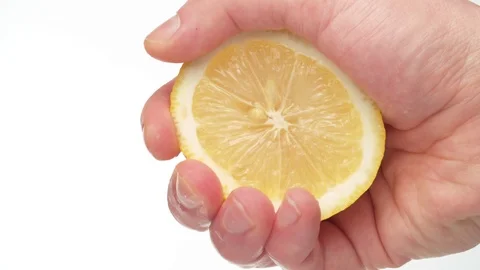 Male hand squeezing a lemon Stock Footage 124114656