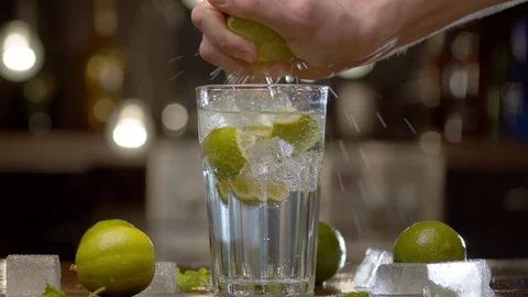 Male hand squeezing lime Stock Footage 125502069