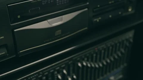 Male hand taking compact disc from CD player, closing tray in hi-fi music center Video stock 287940695