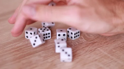 Male hand throwing dice on table Stock Footage 98480300