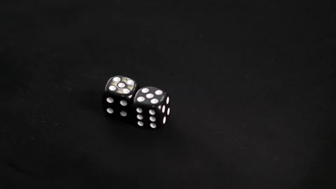 Male hand throwing double 5 dice on black game table. Man rolling five double Stock Footage 140480327