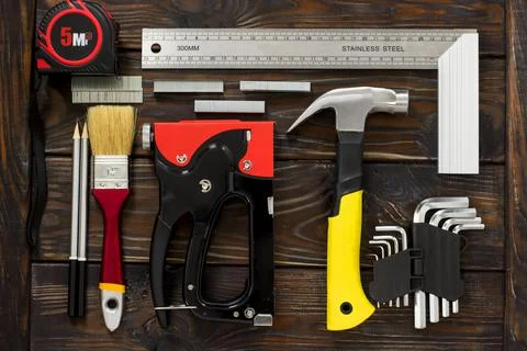 Male hand tool stapler square screwdriver Stock Photos