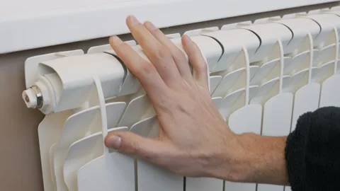 Male Hand Touching Central Heating Radiator To Check Warmth Stock Footage 329921494