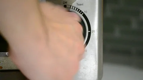 Male Hand Turning on Convection Toaster Oven with Audible Fan Noise and Timer Stock Footage