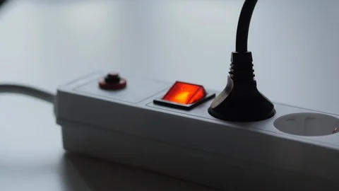 Male Hand Unplugging The Plug From Socket Electric Extension Cord And Turn Off Stock Footage 95346487