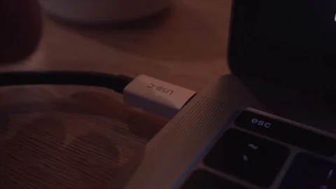 Male hand unplugging USB-C / Type C Cable into a laptop USB-C port. Stock Footage 112241377